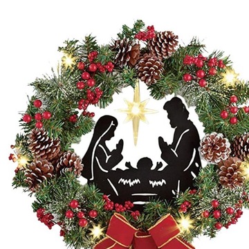 Художник собирает 2 рождественских венка с бантиками