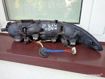 MAZDA MX3 SVĚTLO ZADNÍ LEVÝ DRŽÁK