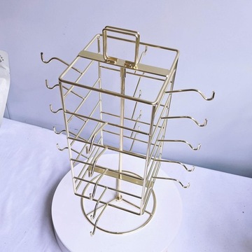 Подставка для солнцезащитных очков вмещает 20 очков. Поворотный держатель