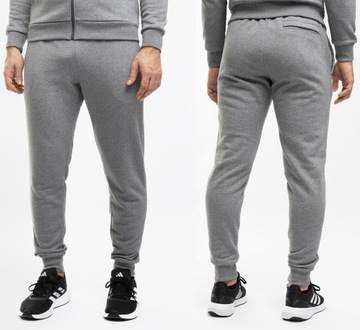 Under Armour spodnie dresowe męskie sportowe joggery Rival Fleece roz.M