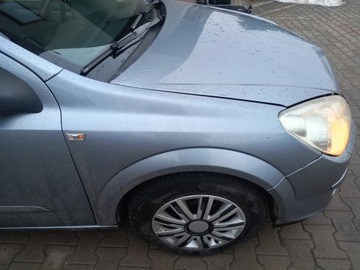 BŁOTNIK PRAWY PRZÓD Opel Astra H 04-11 KOMBI Z163