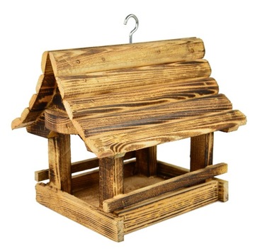 Деревянная кормушка для птиц из обожженной древесины.