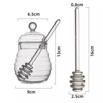 Прозрачный контейнер для меда с ложкой и крышкой.