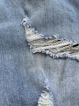 Jeansowe elastyczne spodnie rurki dziury XL 42 MissGuided