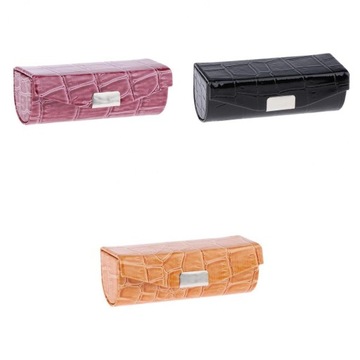 Etui na szminkę z ciemnym brązem i czernią i pomar