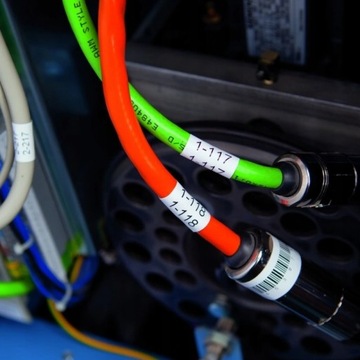 Dymo Rhino 18435, S0718490, 12mm x 5,5m czarny druk / pomarańczowy podkład,