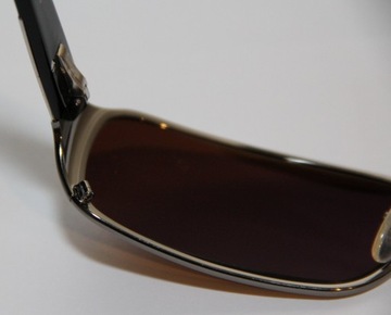 Damskie okulary przeciwsłonec. Prada SPR 06N Nr-76