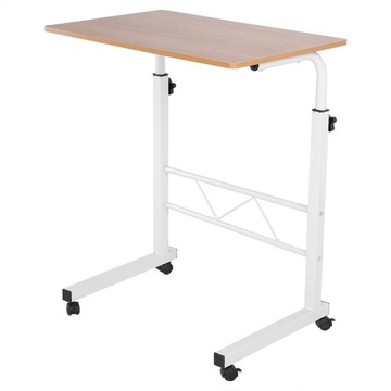 Компьютерный стол с регулируемой высотой, стоящий на столе, с передвижным диваном рядом с кроватью.