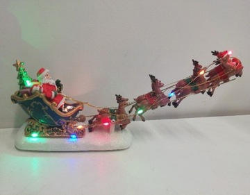 Дед Мороз в санях с оленями