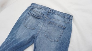 RESERVED spodnie jeansy z przetarciami r 44