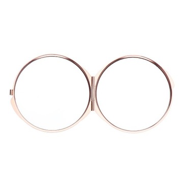 Небольшое портативное круглое косметическое зеркало из розового золота.