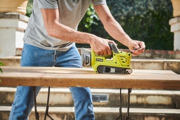 Szlifierka taśmowa RYOBI R18BS-0 + aku + ładowarka
