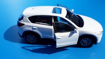 Модель Mazda CX-5 из белого металла WELLY 1:34