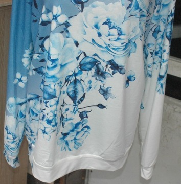Sliczna tunika/ bluza w cudne kwiaty r 50-60