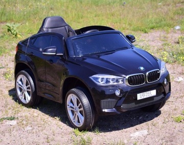 Детский игрушечный автомобиль BMW X6 M, работающий от автомобильного аккумулятора.