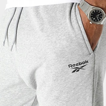 Reebok spodnie dresowe bawełniane męskie małe logo 100067631 szary # M