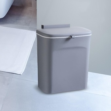 Контейнер для мусора крепится на стену под раковиной, дверца шкафа для компоста на кухне, серая