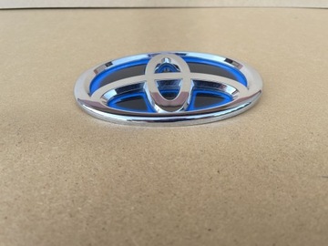 TOYOTA YARIS IV ГИБРИДНЫЙ ЗНАК ПЕРЕДНЯЯ ЭМБЛЕМА