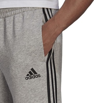 SPODNIE MĘSKIE ADIDAS ESSENTIALS TAPERED CUFF 3 STRIPES SZARE GK8976 r 2XL