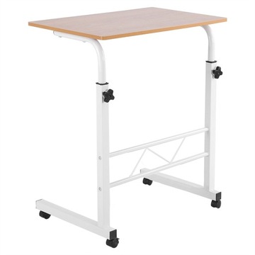 Компьютерный стол с регулируемой высотой, стоящий на столе, с передвижным диваном рядом с кроватью.