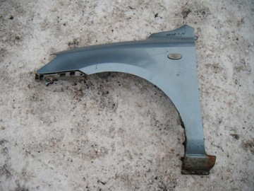 MAZDA 2 II DY 1.4 02-07 BŁOTNIK LEWY PRZÓD