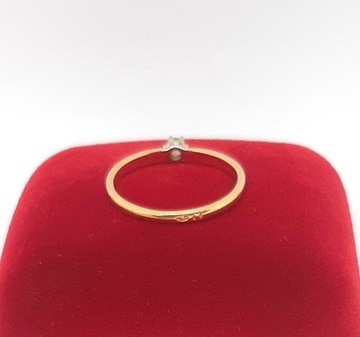 Złoty pierścionek z Brylantem PR.585 W:1,51gr R.12 .