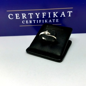 Złoty pierścionek z Diamentami 0,12ct Pr.585 W:1,41g R.8 s