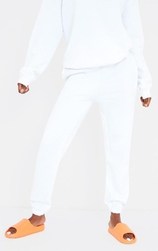 Prettylittlething NG4 lpk białe spodnie dresowe joggery S