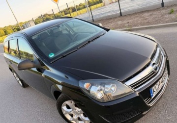 Opel Astra J Sports Tourer 1.6 Twinport ECOTEC 115KM 2010 Opel Astra LIFT 1.6i 115ps PDC GrzaneFotele Klima Doinwestowana Bezwypadko, zdjęcie 11