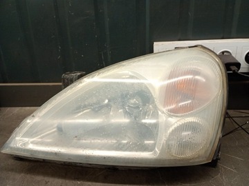 SVĚTLOMET LEVÝ PŘEDNÍ SUZUKI LIANA I 01-07R