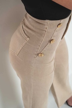 Jeansowe damskie spodnie elastyczne beżowe dzwony szeroka nogawka stan L