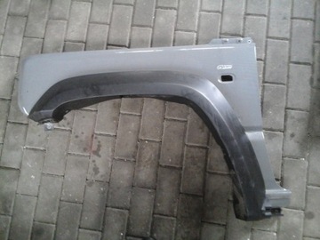 SUZUKI JIMNY BŁOTNIK LEWY NOWY MODEL