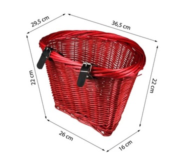 Красная плетеная корзина, скрепленная ремнями.