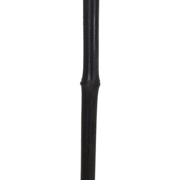 Деревянный черный садовый факел, вставленный в сад