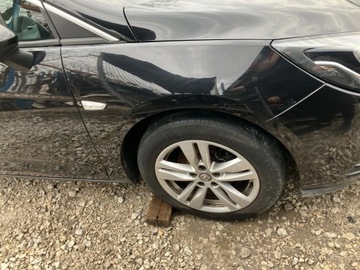 BŁOTNIK PRAWY PRZÓD PRZEDNI OPEL ASTRA V K 15- Z22Y
