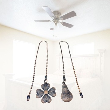 Удлинительная цепочка веером с декором в виде красно-коричневых шариков.