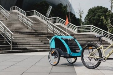 PRZYCZEPKA ROWEROWA WÓZEK NA DZIECI KOMFORT DO ROWERU KOŁA POMPOWANE LUX