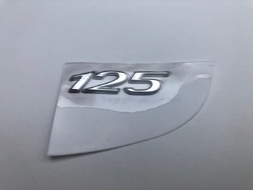 Эмблема Vespa Primavera Sprint в кабине 