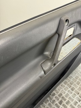 BOCZEK TAPICERKA DRZWI LEWY PRZÓD MITSUBISHI PAJERO II 5D MR776490