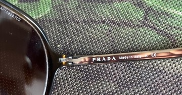 Damskie okulary przeciwsłonec. Prada SPR 06N Nr-76