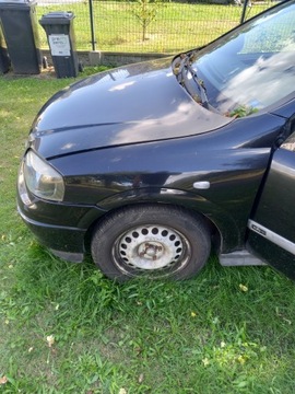 Błotnik przedni lewy czarny Opel astra G II 2001r hatchback