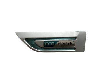 ZNACZEK EMBLEMAT LISTWA BŁOTNIKA LEWA 87773-E4000 KIA SOUL EV