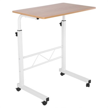 Компьютерный стол с регулируемой высотой, стоящий на столе, с передвижным диваном рядом с кроватью.