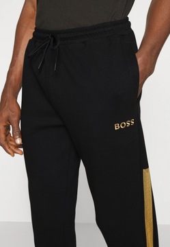 Dresy HUGO BOSS czarne spodnie dresowe męskie r.XL złote lampasy bawełniane