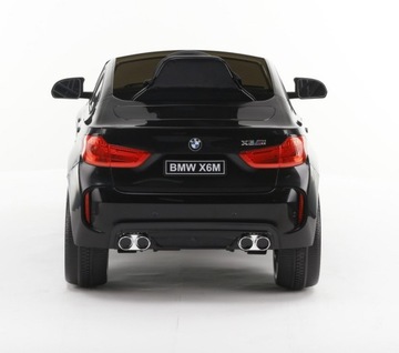 Детский игрушечный автомобиль BMW X6 M, работающий от автомобильного аккумулятора.