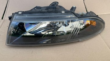 Lampa lewa przód Mitsubishi CAISMA Lift FL EU europejska Hella