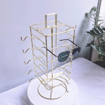 Подставка для солнцезащитных очков вмещает 20 очков. Поворотный держатель