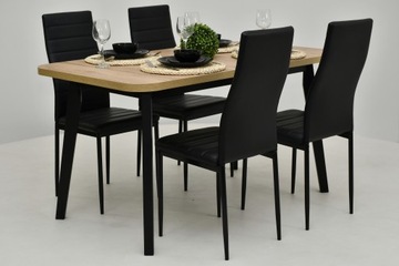 стол с закругленными углами, 4 черных стула.