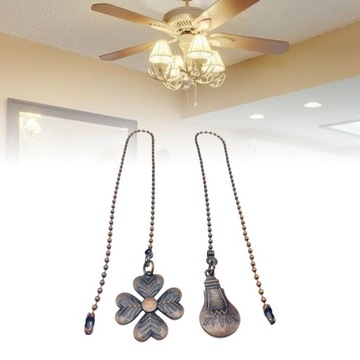 Удлинительная цепочка веером с декором в виде красно-коричневых шариков.