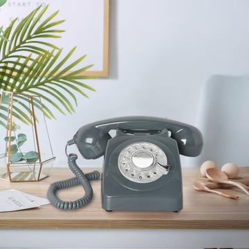 Стационарный телефон в стиле ретро. Телефон с дисковым набором номера в винтажном стиле, серый.
